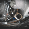Performance downpipe with heat shield installed in BMW S58 engine - downpipe installation service for M2, M3, M4 at Bimmer Tech in Los Angeles and Orange County
